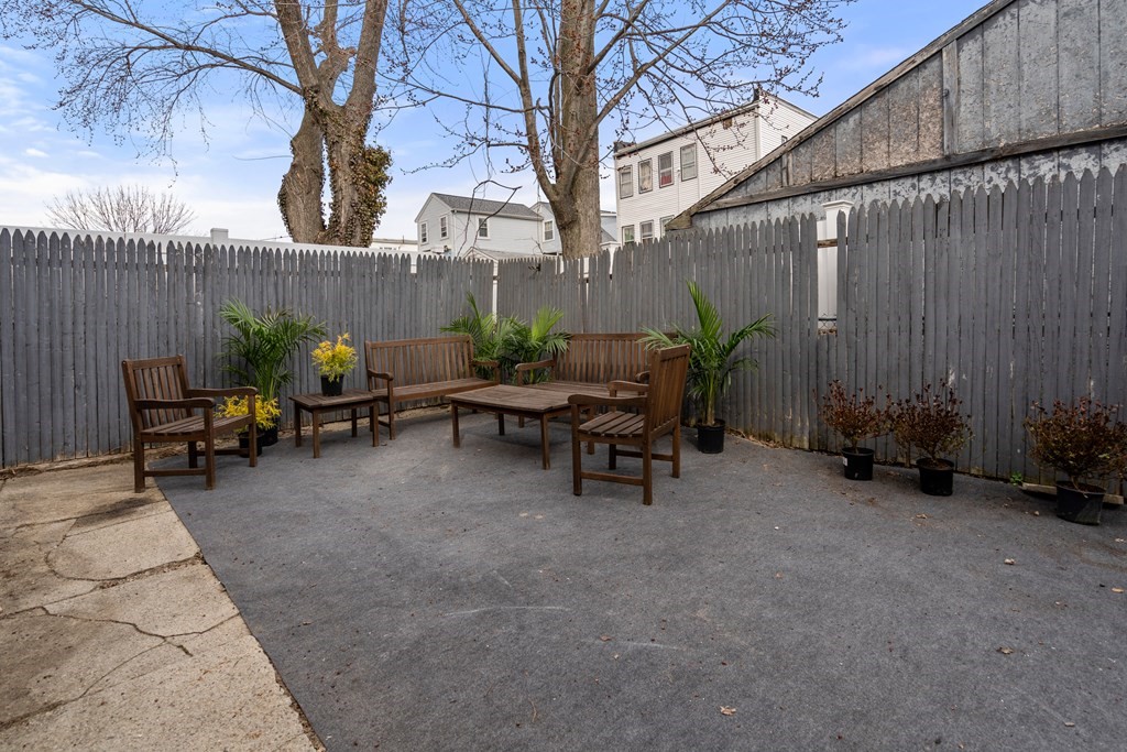 9 Baker Road Everett, MA 02149 - Photo 13 of 14 a view of backyard with outdoor seating and green space