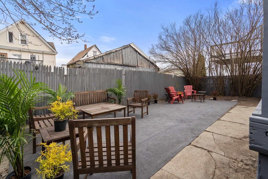 9 Baker Road Everett, MA 02149 - Photo 14 of 14 a view of a chairs and table in the backyard