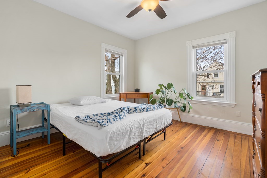9 Baker Road Everett, MA 02149 - Photo 8 of 14 a living room with a bed furniture and a window