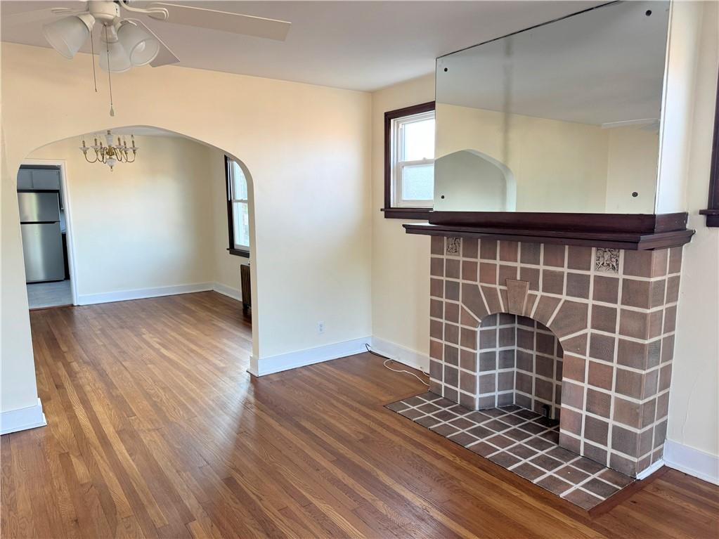 538 Halsey Avenue, Unit 2 Pittsburgh, PA 15221 - Photo 3 of 6 a view of an empty room with wooden floor and a window