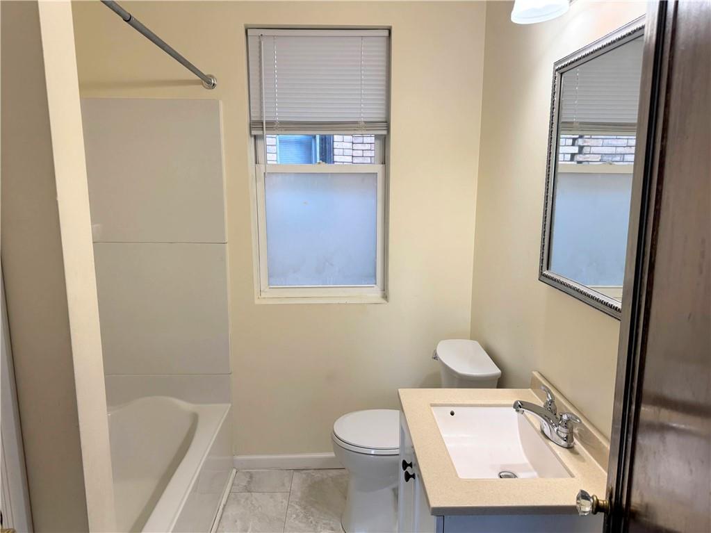 538 Halsey Avenue, Unit 2 Pittsburgh, PA 15221 - Photo 6 of 6 a bathroom with a toilet and a sink