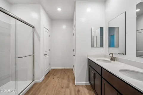 a bathroom with a sink double vanity and a mirror