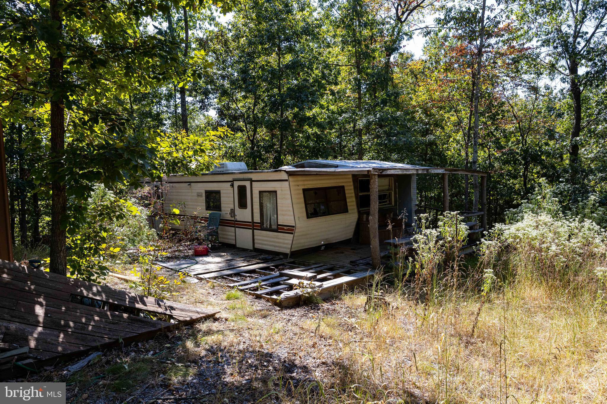 17.33-ac Shale Pit Drive Falling Waters, WV 25419 - Photo 7 of 7 a view of house with a yard