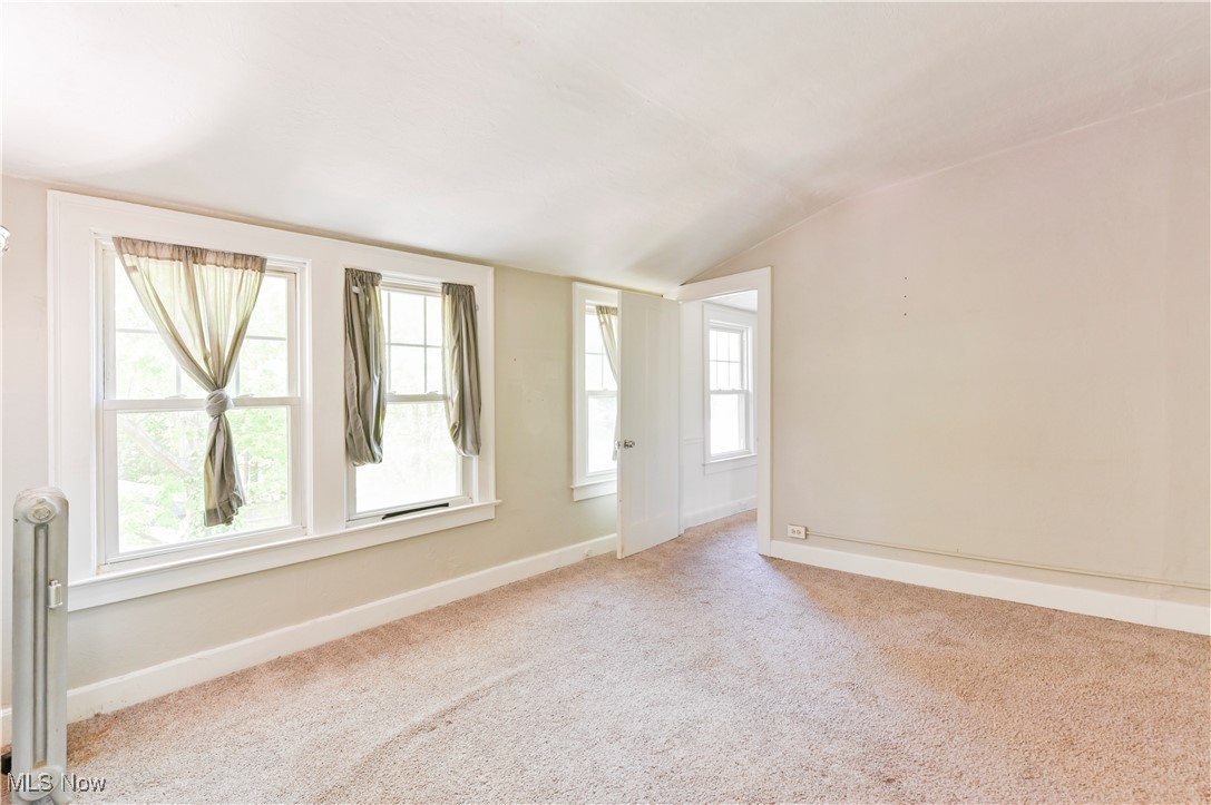 1584 Rydalmount Road Cleveland Heights, OH 44118 - Photo 24 of 36 Carpeted bedroom room with vaulted ceiling and baseboards
