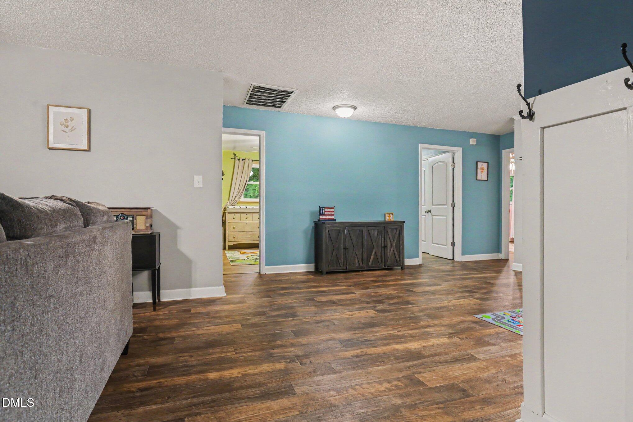 977 Stevens Mill Road Goldsboro, NC 27530 - Photo 17 of 31 a view of a livingroom with wooden floor and closet