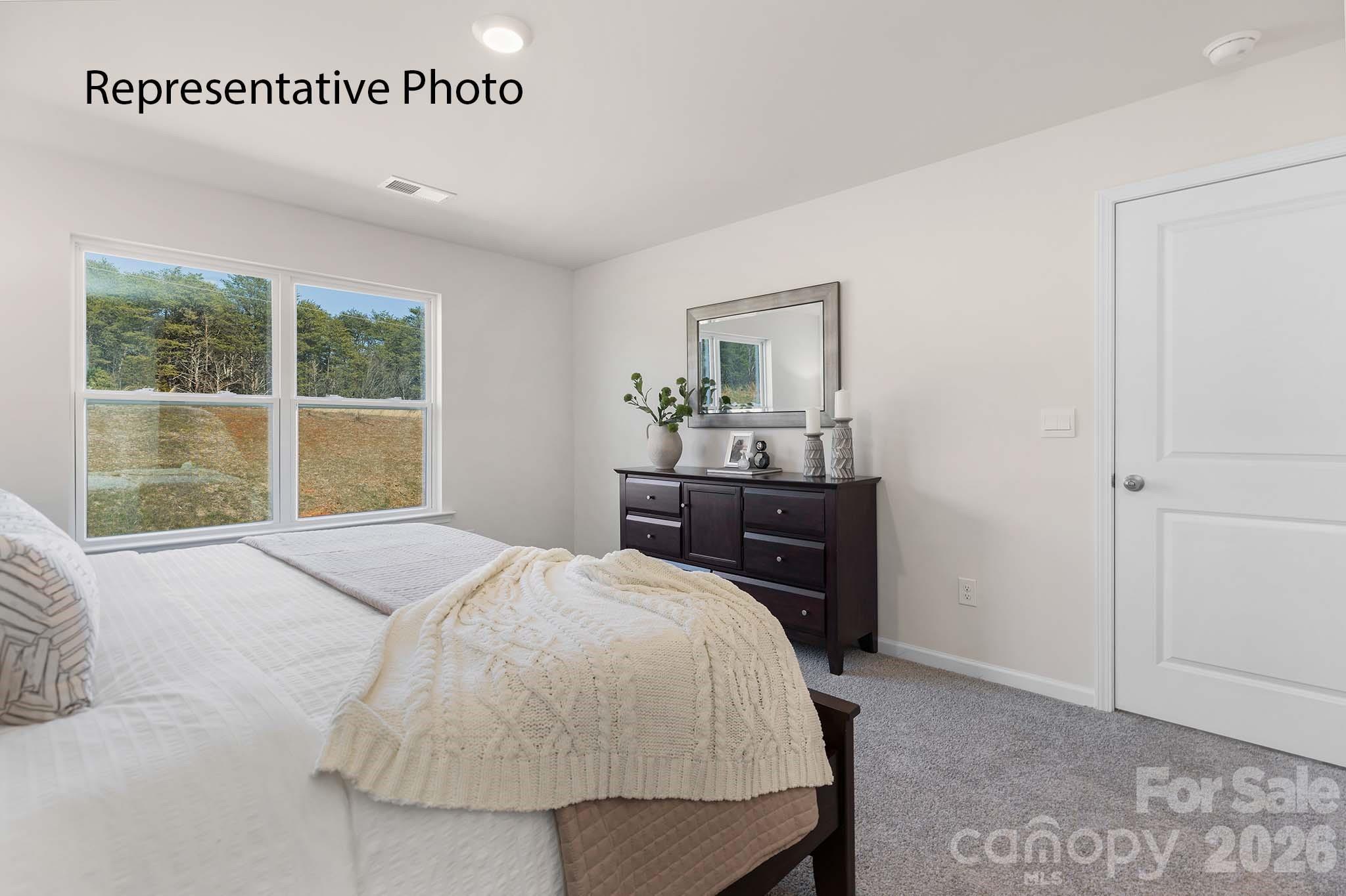 2696 Goose Fair Road Maiden, NC 28650 - Photo 8 of 21 a bedroom with a bed and window