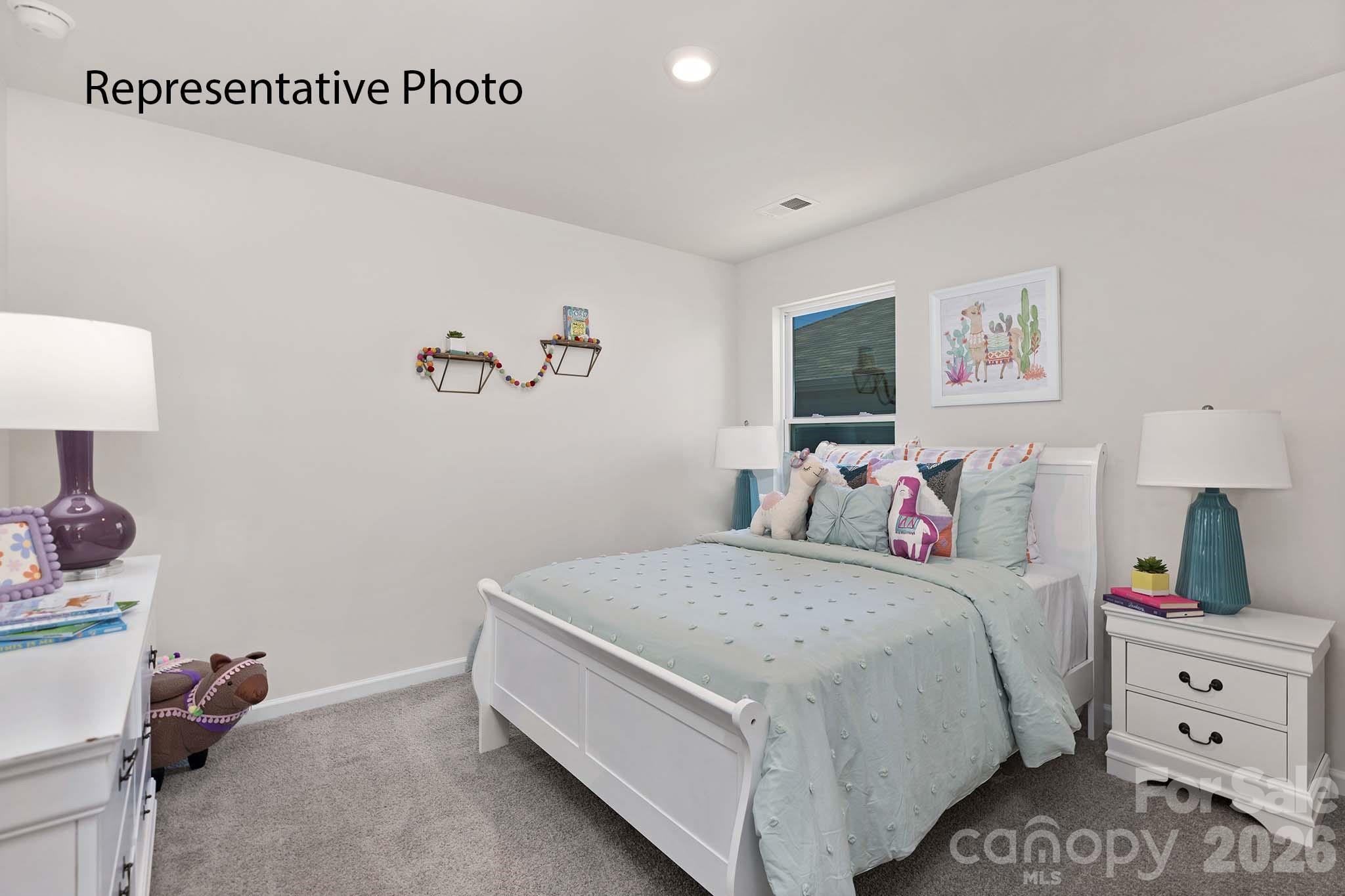 2696 Goose Fair Road Maiden, NC 28650 - Photo 9 of 21 a bed room with a bed and a night stand