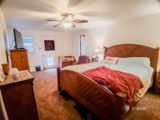 256 North Norma Street Ridgecrest, CA 93555 - Photo 8 of 35 a bedroom with bed and wooden floor