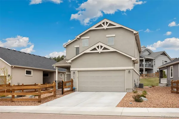 a front view of a house with garage