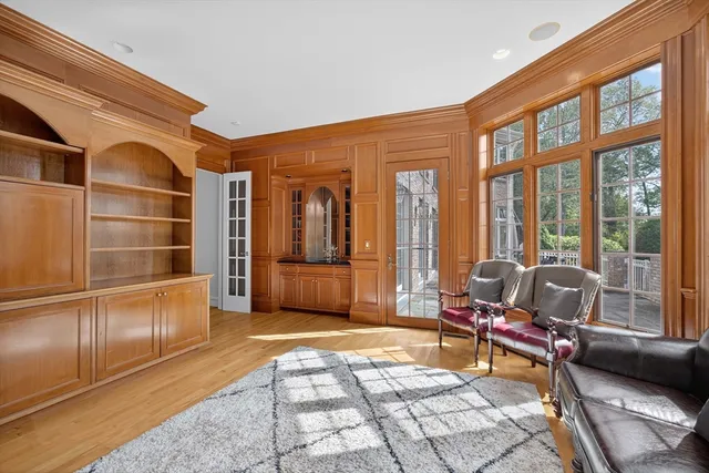 a living room filled with furniture and a rug
