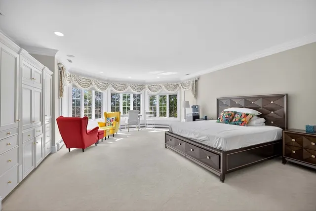 a spacious bedroom with a bed and a couch