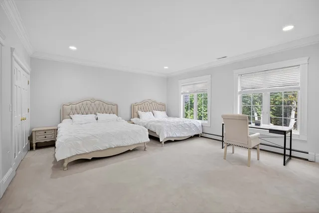 a bathroom with a granite countertop sink a toilet and shower
