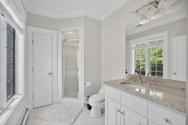 a spacious bedroom with two beds and large window