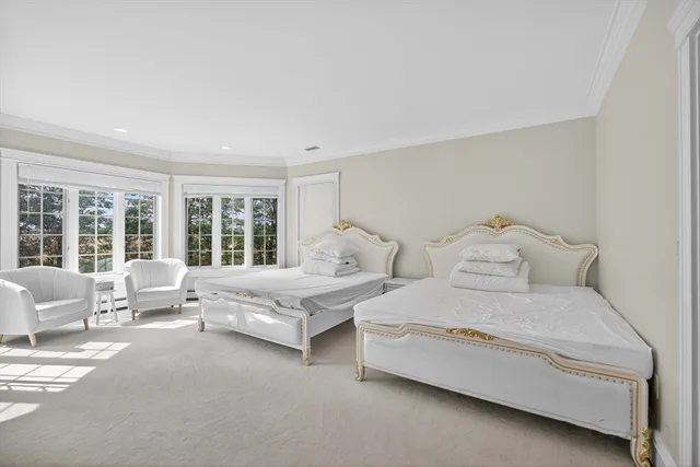 a bathroom with a granite countertop sink toilet and next to a window