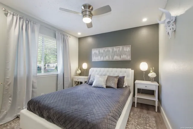 a bedroom with a bed and a window