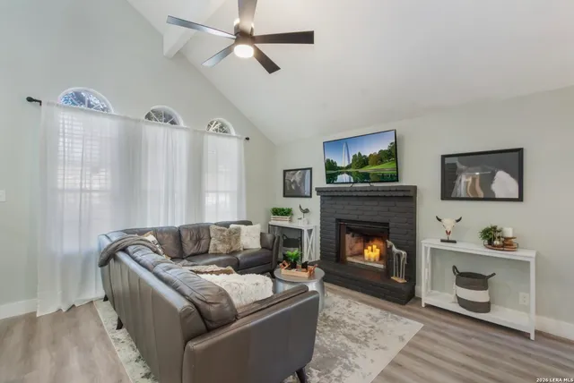 a living room with furniture and a fireplace