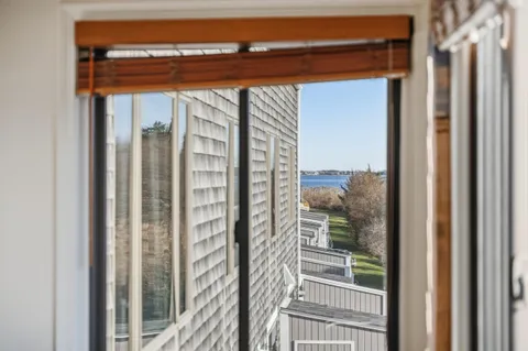 a view of a glass door and a window