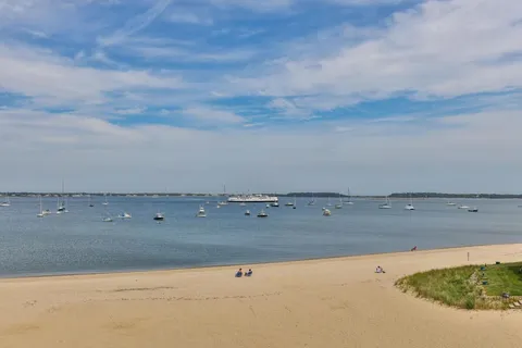 an aerial view of beach and city