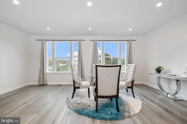 a view of kitchen with dining table and chairs