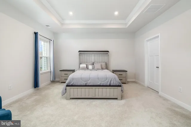 a bathroom with a sink a toilet a vanity and mirror