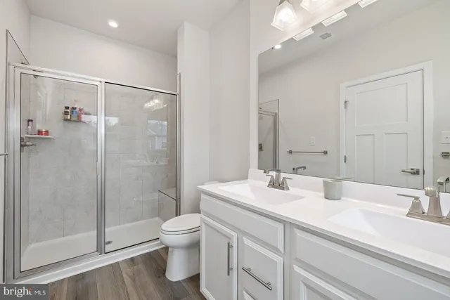 a bathroom with a sink a toilet and a bathtub