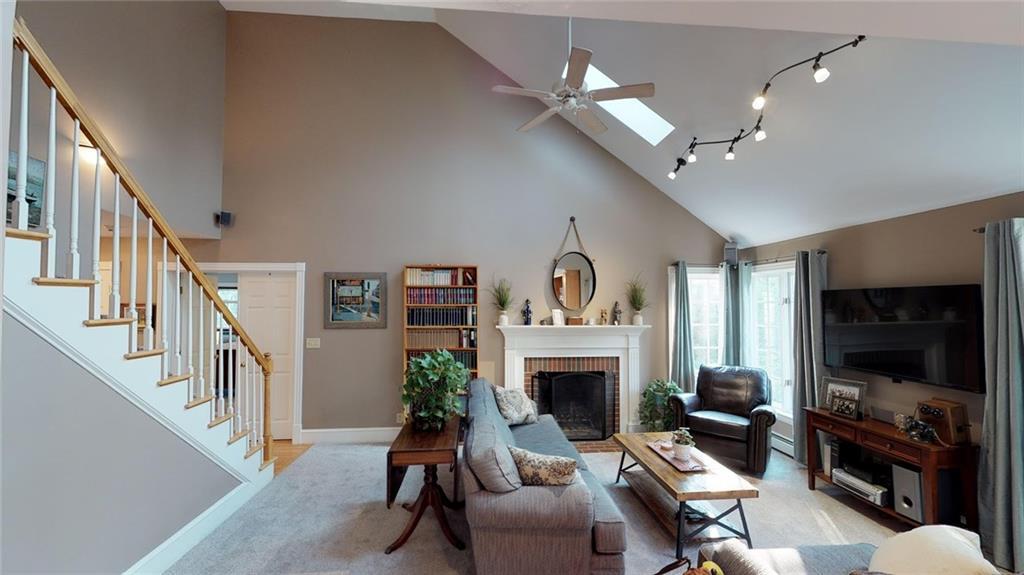 547 Pownal Road Auburn, ME 04210 - Photo 12 of 28 Living room with skylights and...