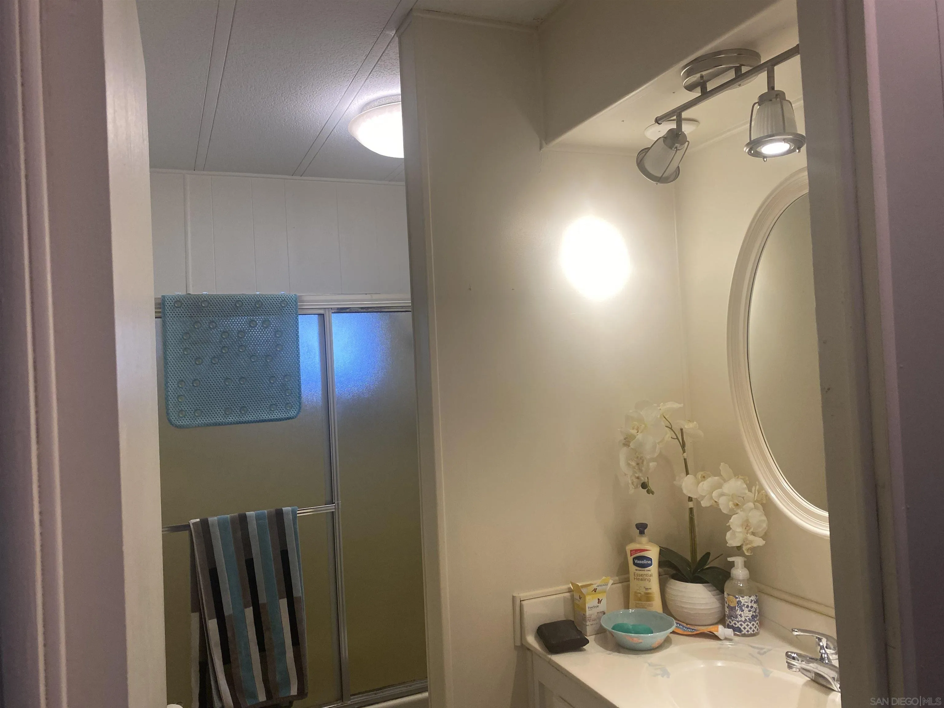 1925 Otay Lakes Road, Unit 88 Chula Vista, CA 91913 - Photo 13 of 15 a bathroom with a sink and a mirror