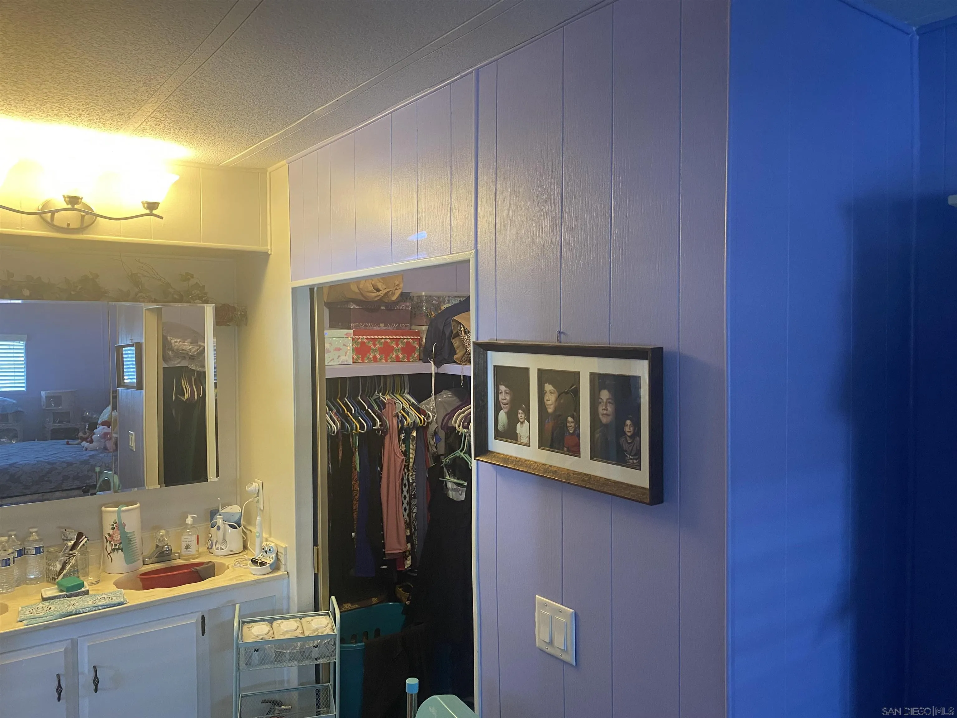 1925 Otay Lakes Road, Unit 88 Chula Vista, CA 91913 - Photo 15 of 15 a bathroom with a sink a mirror and a shower