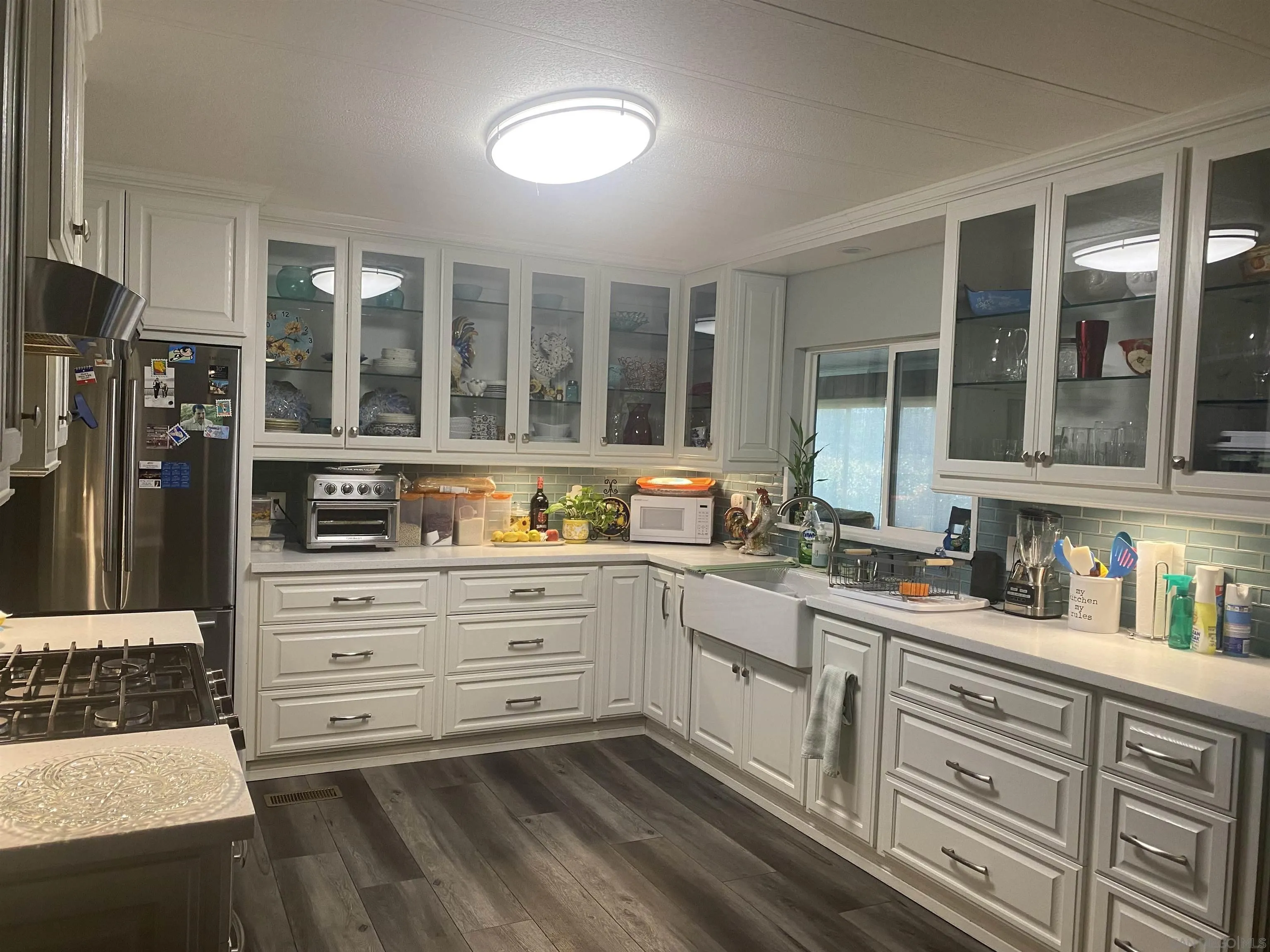 1925 Otay Lakes Road, Unit 88 Chula Vista, CA 91913 - Photo 8 of 15 a kitchen with cabinets appliances and a window