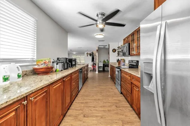 a view of a dining room with furniture and a chandelier