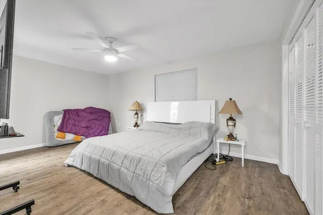 a bedroom with a bed and a walk in closet