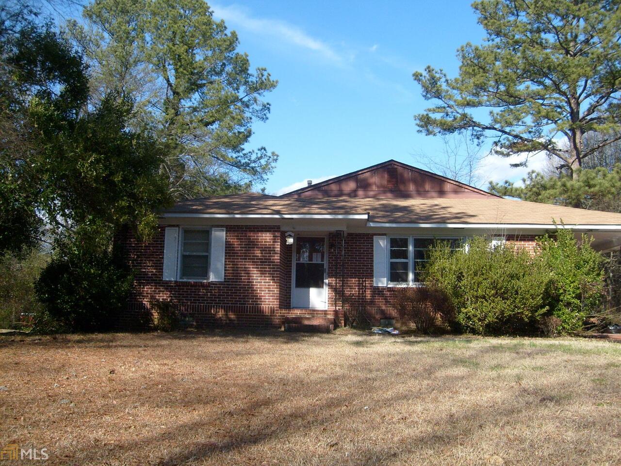 14 Meadow Lane Southwest Rome, GA 30165 - Photo 1 of 1 a front view of house with yard and trees around