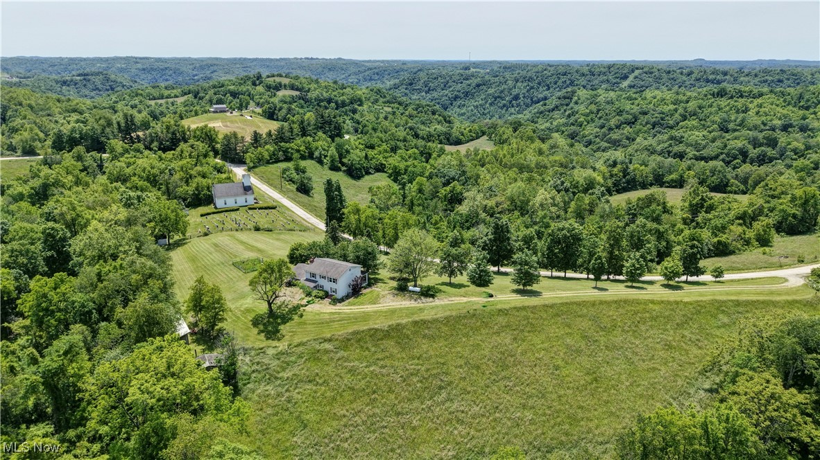 48846 Cain Ridge Road Clarington, OH 43915 - Photo 39 of 45 Drone / aerial view of a heavily wooded area