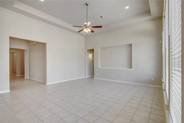 a view of an empty room and a window