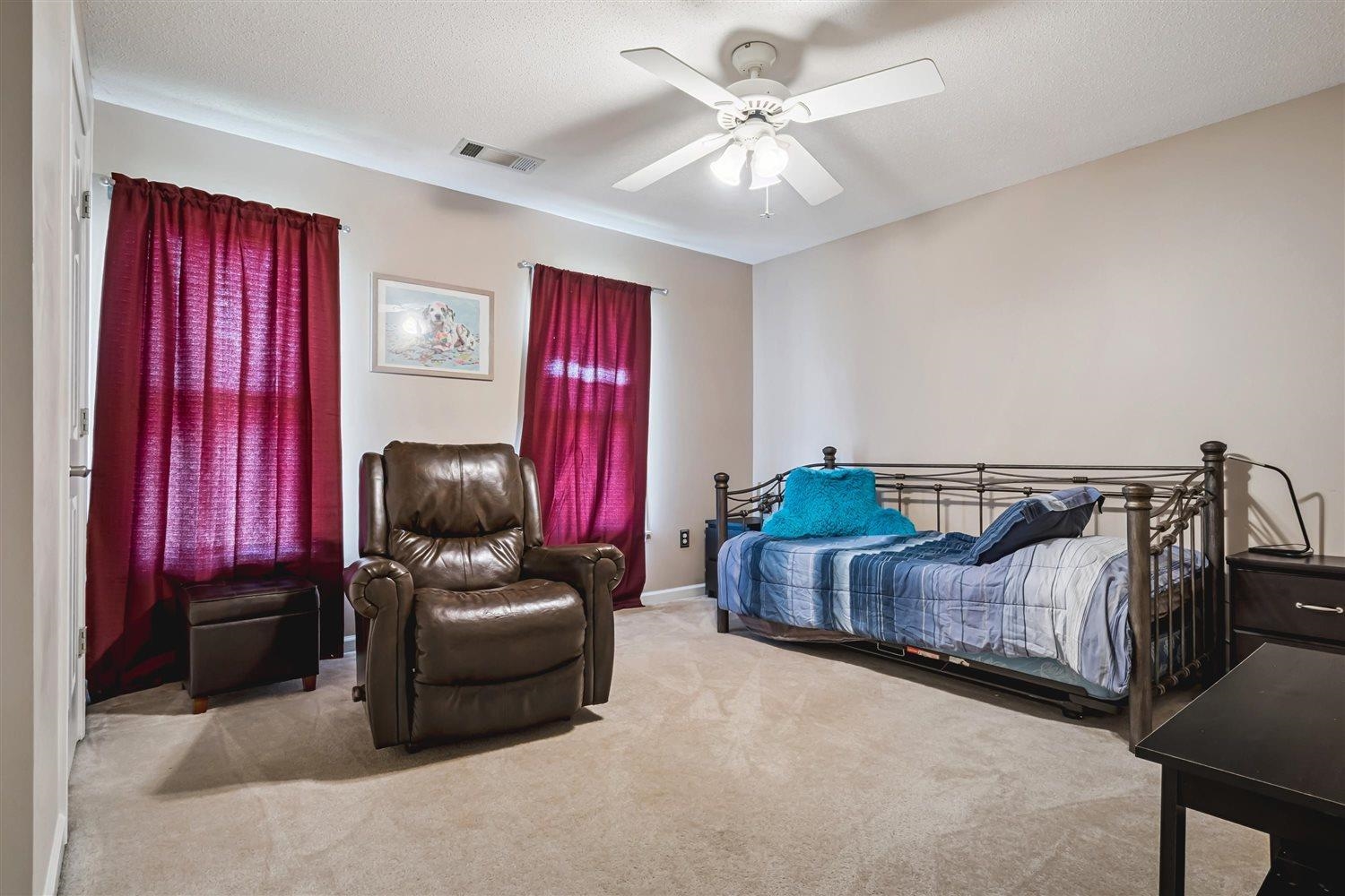 1489 John Ridge Drive Collierville, TN 38017 - Photo 29 of 39 a bedroom with furniture and a bed