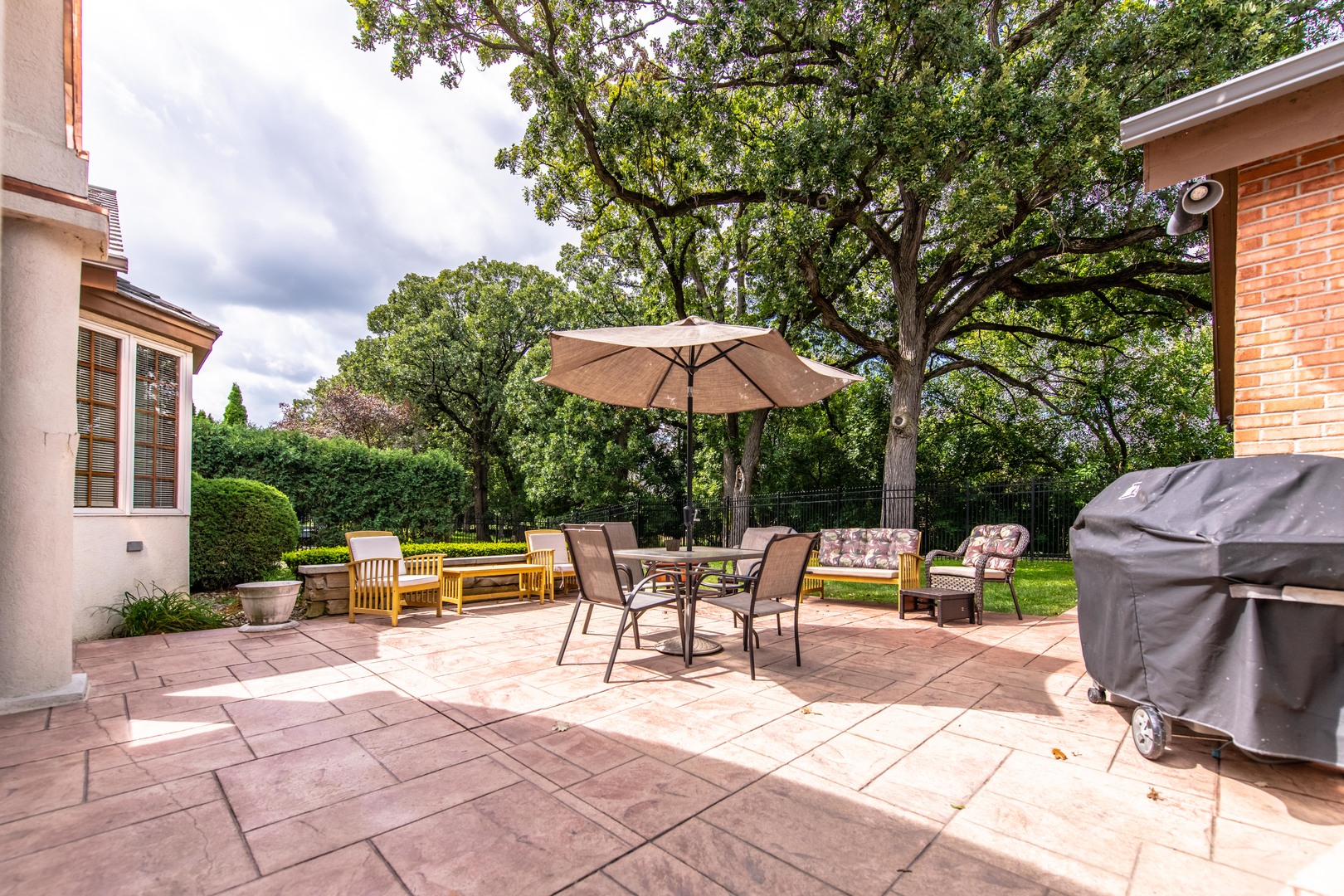 717 Westridge Road Joliet, IL 60431 - Photo 17 of 68 a view of backyard with outdoor seating and trees