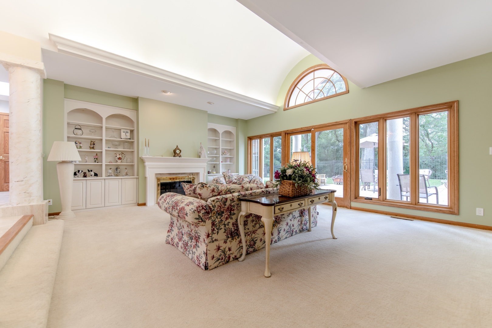 717 Westridge Road Joliet, IL 60431 - Photo 22 of 68 a living room with furniture a fireplace and a large window