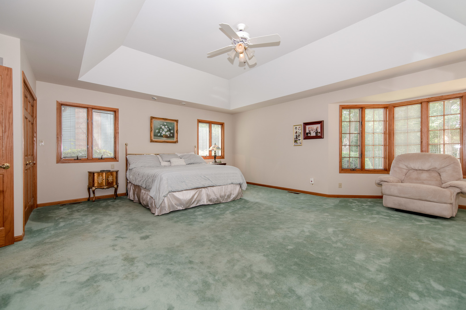 717 Westridge Road Joliet, IL 60431 - Photo 25 of 68 a spacious bedroom with a bed and a couch