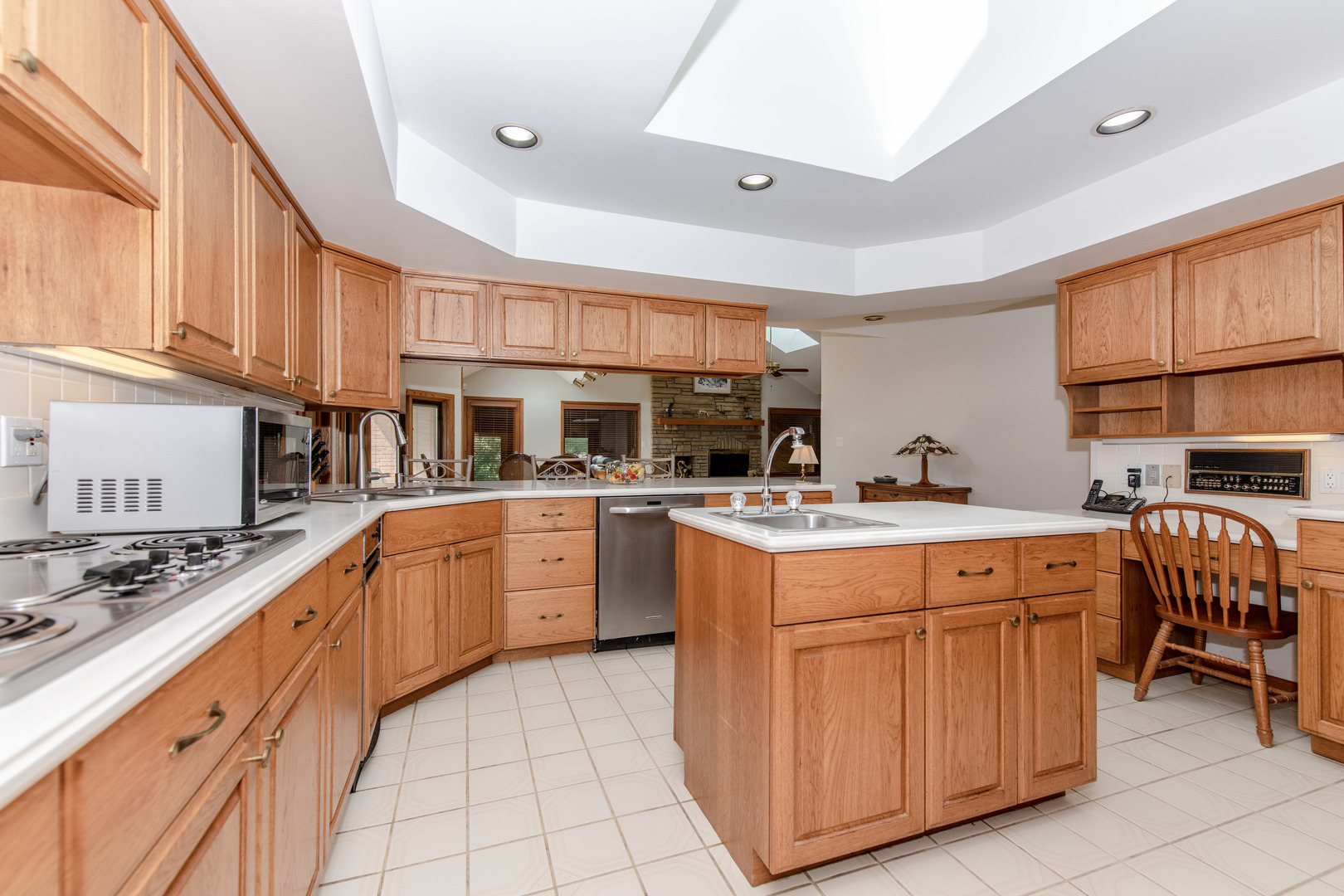 717 Westridge Road Joliet, IL 60431 - Photo 52 of 68 a kitchen with stainless steel appliances granite countertop a stove and cabinets