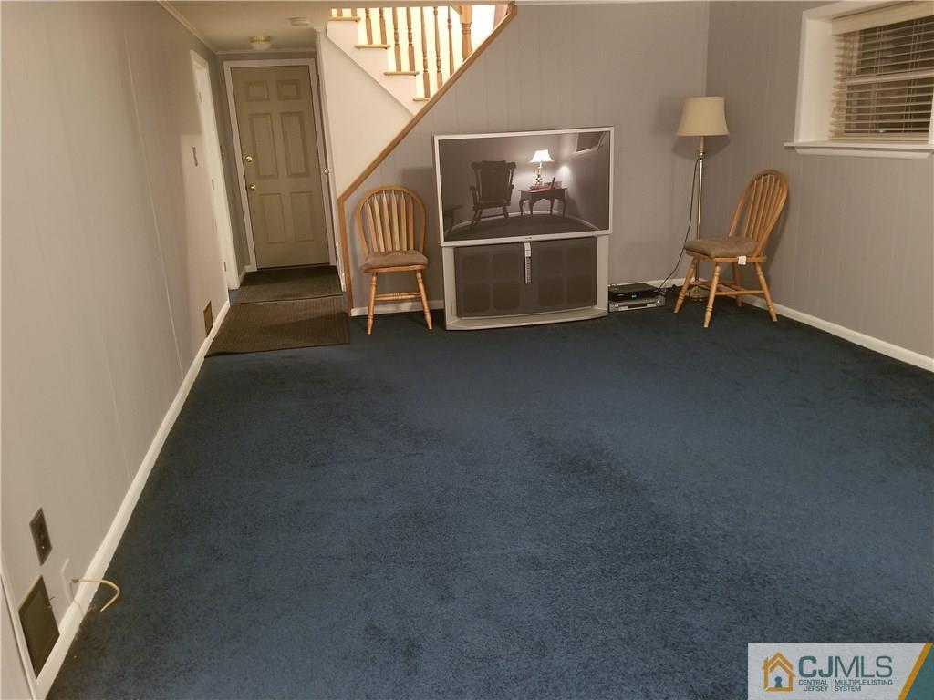 47 Harmon Road Edison, NJ 08837 - Photo 18 of 24 a view of livingroom with furniture and windows