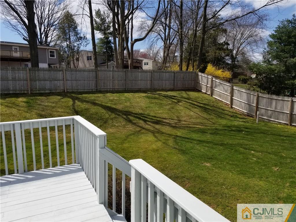 47 Harmon Road Edison, NJ 08837 - Photo 23 of 24 a view of a pathway with a wrought fence