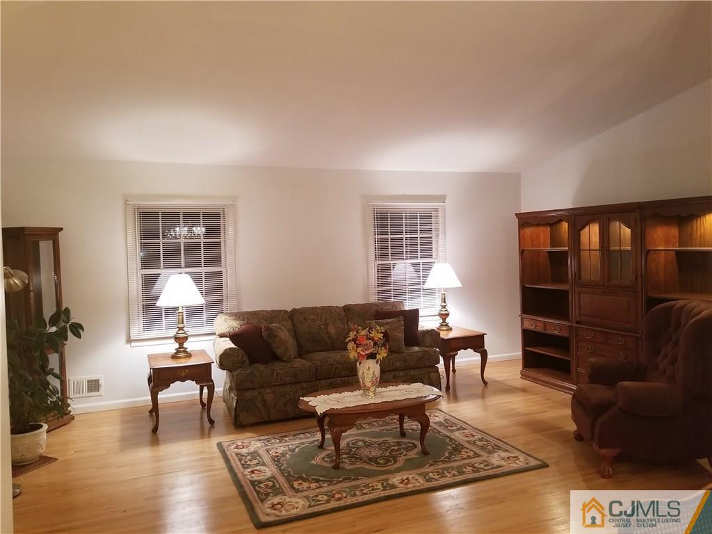 47 Harmon Road Edison, NJ 08837 - Photo 4 of 24 a living room with furniture and a window