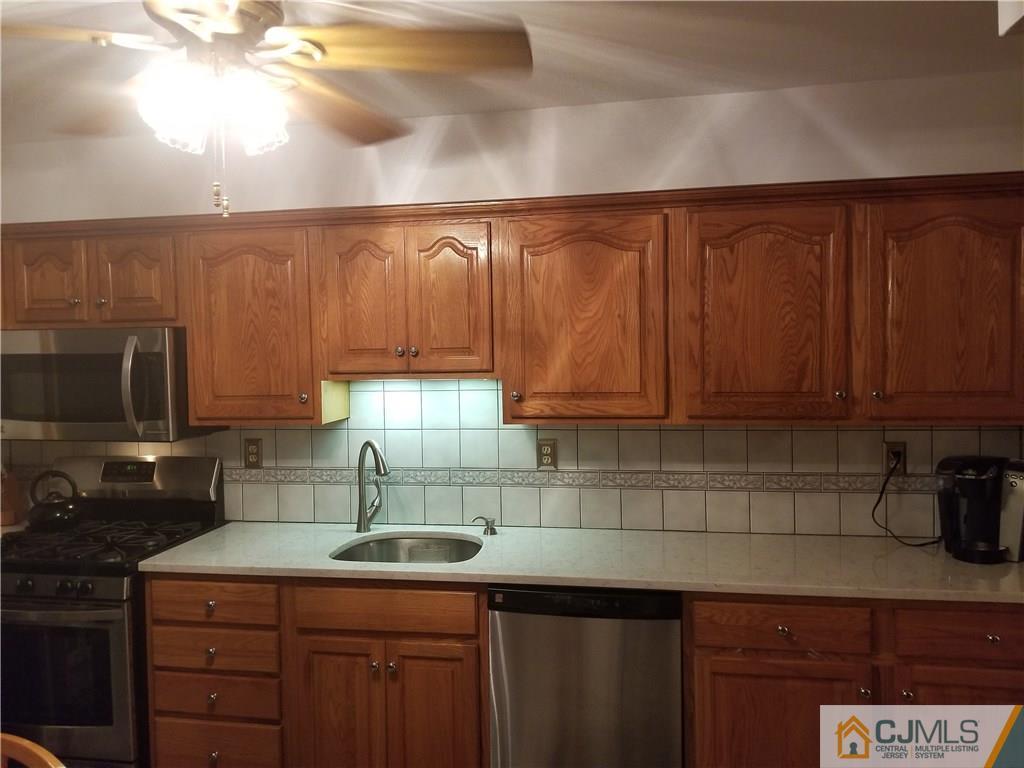 47 Harmon Road Edison, NJ 08837 - Photo 5 of 24 a kitchen with a sink and cabinets