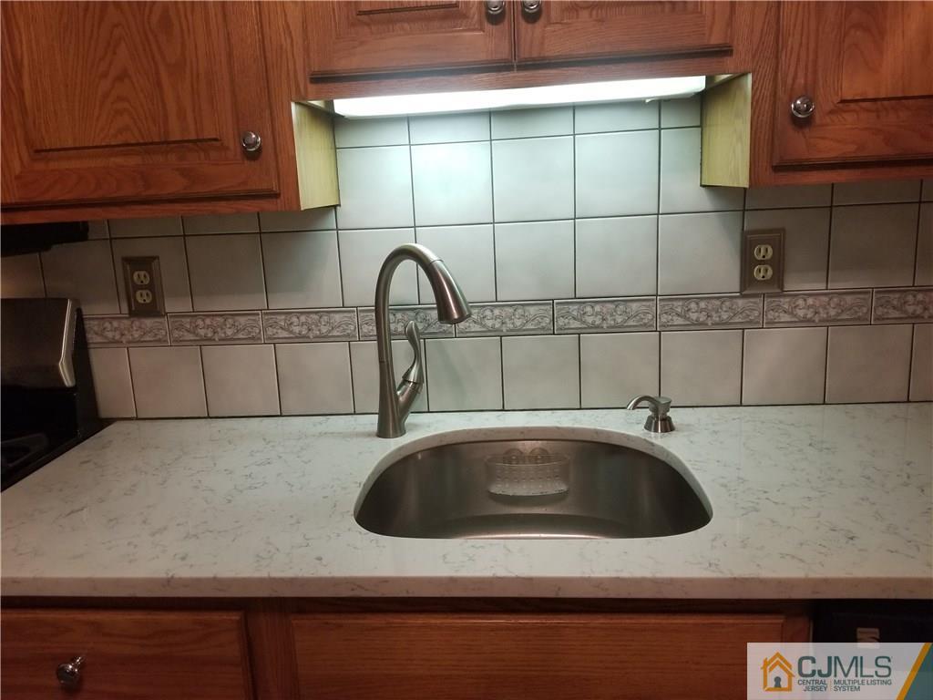 47 Harmon Road Edison, NJ 08837 - Photo 6 of 24 a kitchen with a sink and cabinets