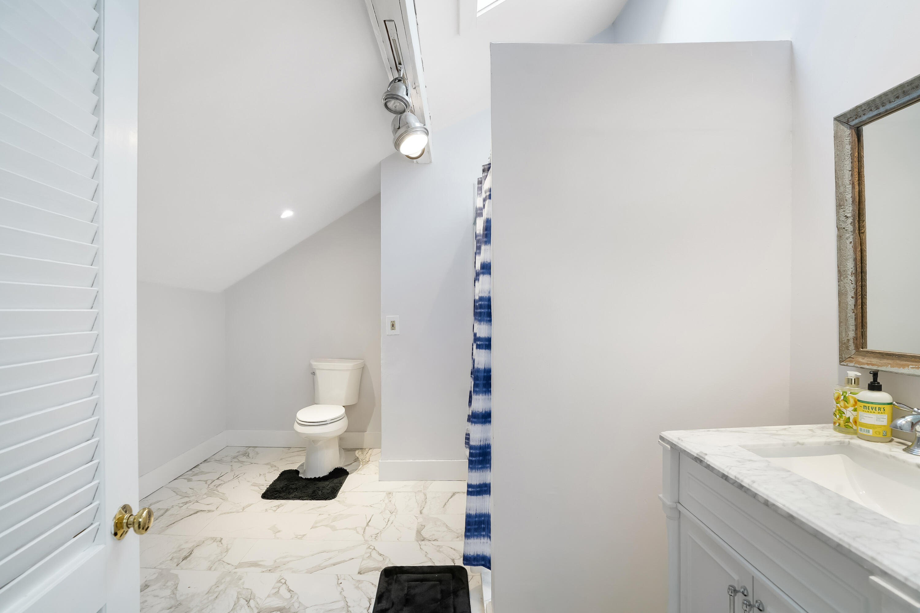 32 Norton Orchard Road Edgartown, MA 02539 - Photo 23 of 26 a bathroom with a sink toilet and vanity