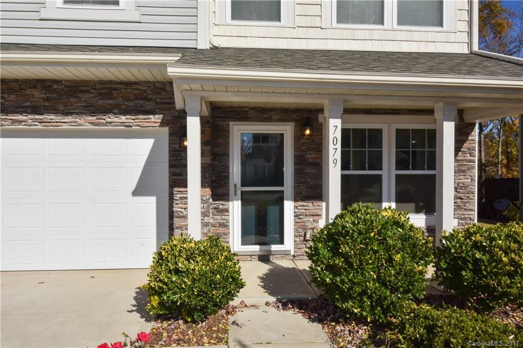 7079 Meyer Road Fort Mill, SC 29715 - Photo 2 of 20 a front view of a house with a garden