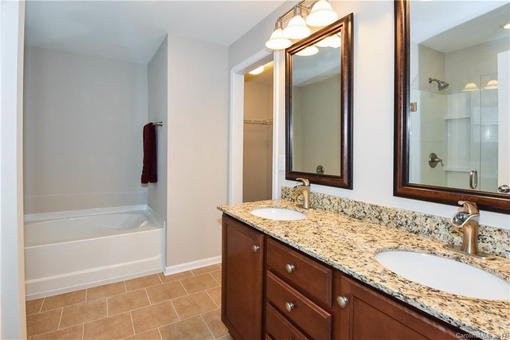 7079 Meyer Road Fort Mill, SC 29715 - Photo 13 of 20 a bathroom with a granite countertop sink and a mirror