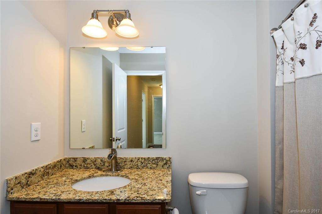7079 Meyer Road Fort Mill, SC 29715 - Photo 16 of 20 a bathroom with a granite countertop sink and a mirror
