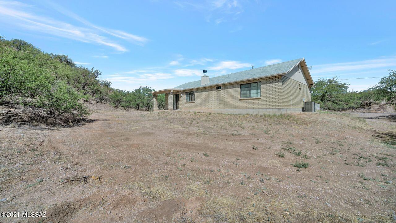 999 Circulo Golondrina Rio Rico, AZ 85648 - Photo 35 of 36 a view of an house with backyard and trees