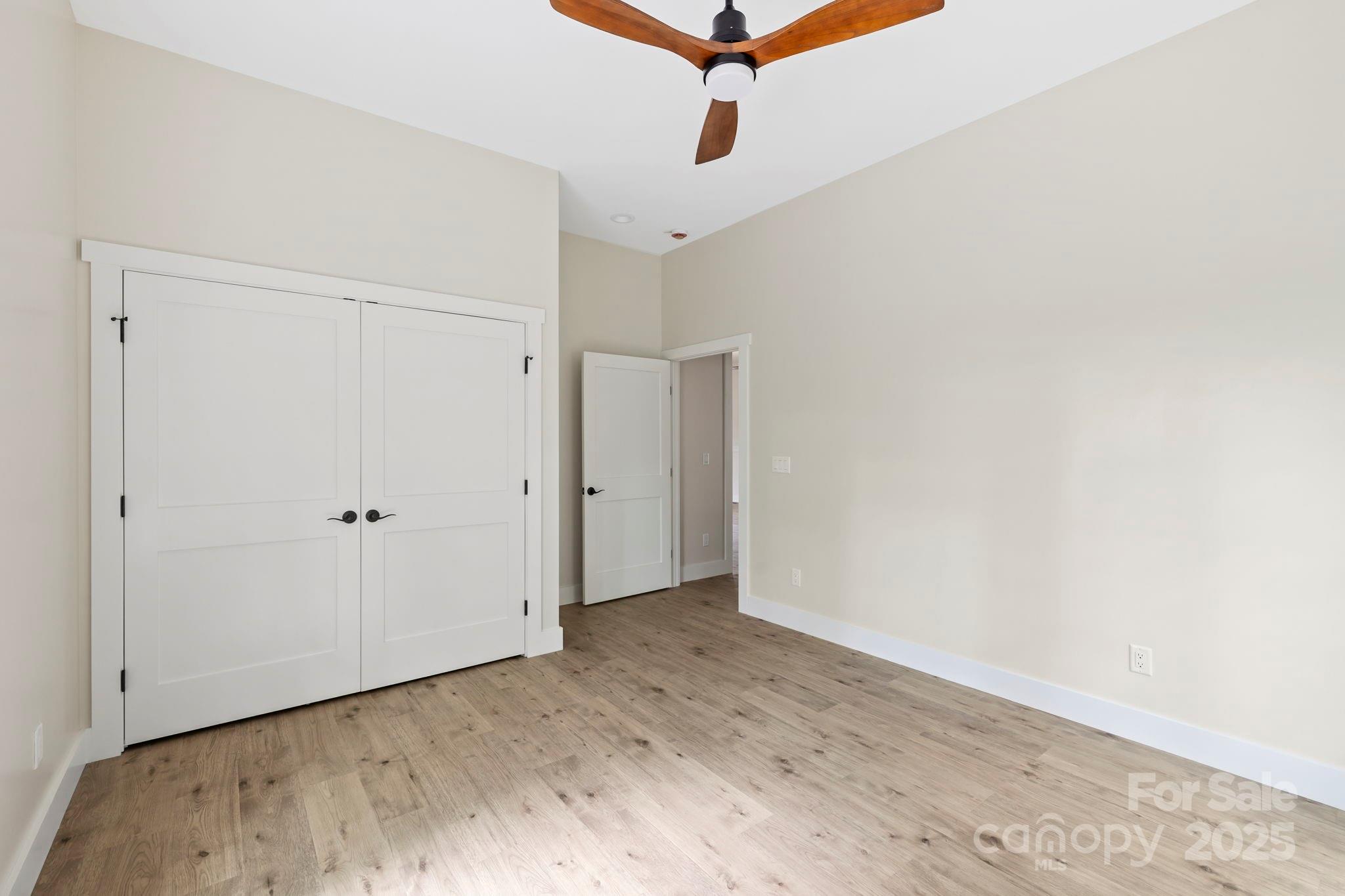 939 Rocky Mountain Road Lake Toxaway, NC 28747 - Photo 17 of 23 a view of a room with wooden floor